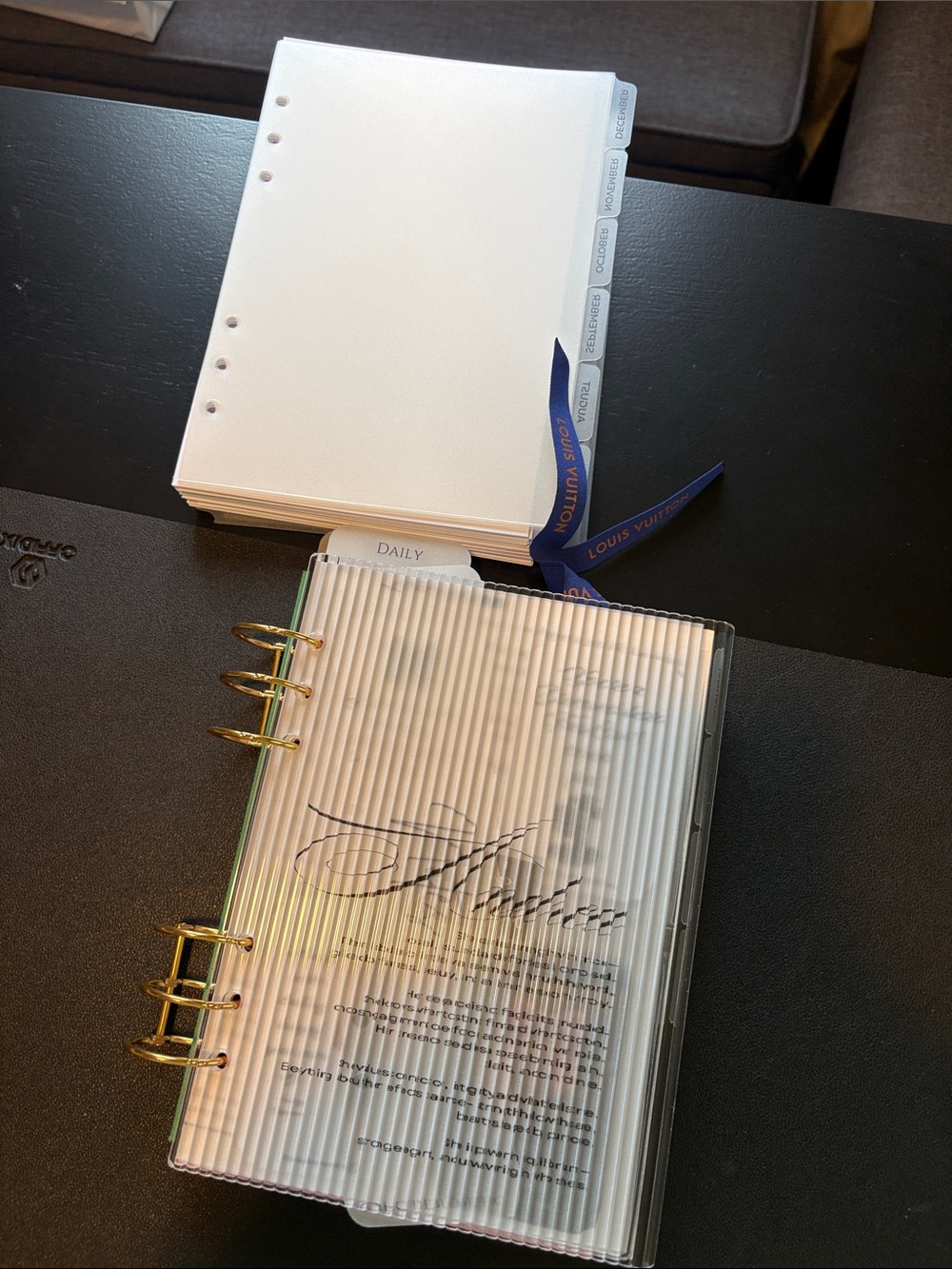 A5 Planner Pages with Blue Ribbon and Gold Rings.